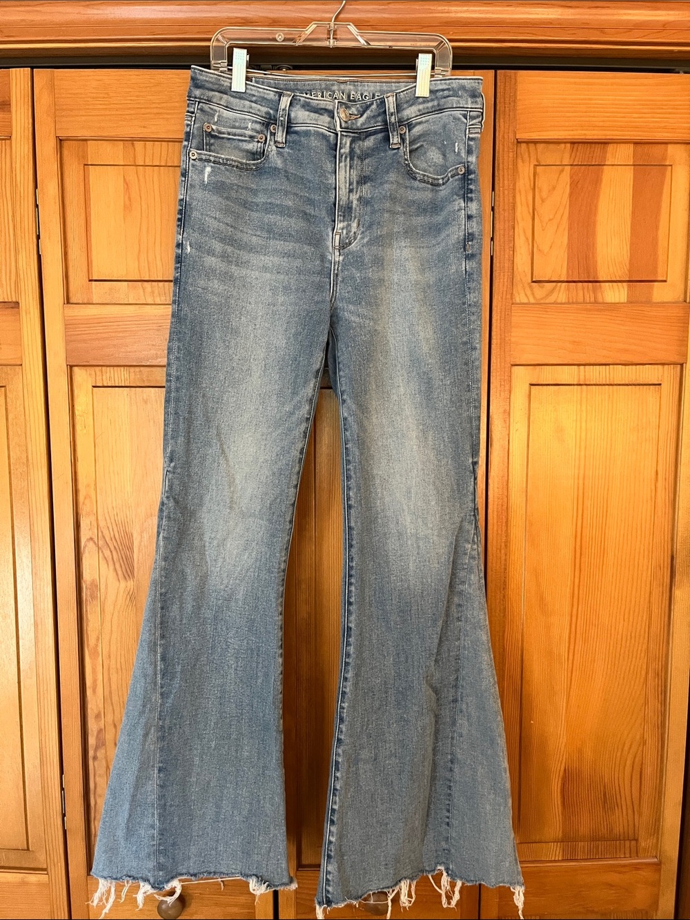 American Eagle Outfitters Medium Blue Flare Jeans with Frayed Hem
